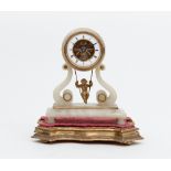A 19th Century French onyx mantel clock with cherub swing pendulum,