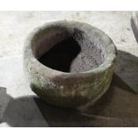 A circular stone trough,