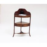 A George III mahogany corner wash stand with splash back fitted a bowl,