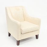 A mahogany and cream upholstered tub type armchair with flat back and sloping arms,