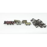 A 4-4-2 Hornby locomotive, in maroon, various rolling stock, track, etc.