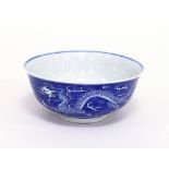 A Chinese blue and white dragon bowl, bearing apocryphal Kangxi marks, 16.25cm diameter Condition