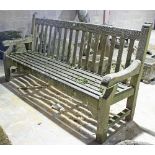 A wooden slatted garden seat, 182cm wide Condition Report: The lower back rail has a split and