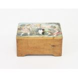 A child's hand cranked musical box, transfer printed a scene of children playing with bees,