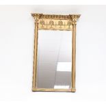 A Regency gilt wall mirror with breakfront ball studded frame and foliate relief to the frieze and