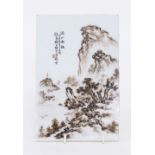 A Chinese porcelain plaque painted with mountainous landscape and calligraphy, 19.5cm x 13cm