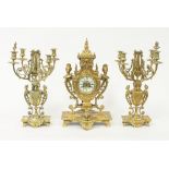 A late 19th Century gilt metal eight-day clock set,