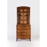 A George III mahogany secretaire bookcase, the arch pediment with reeded reserves,