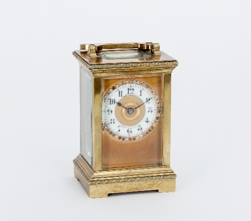 A late 19th Century gilt brass eight-day carriage clock, the case with rope borders,