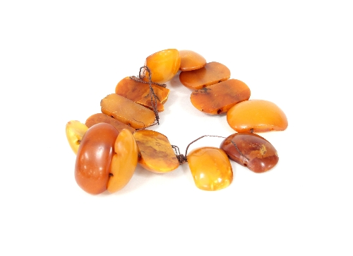 A fourteen bead amber bracelet