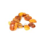 A fourteen bead amber bracelet