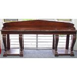 A fine mahogany serving table of Regency design, the rectangular top with galleried back,