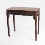 A Chinese hardwood altar table, the rectangular top on a carved frieze, on square legs,