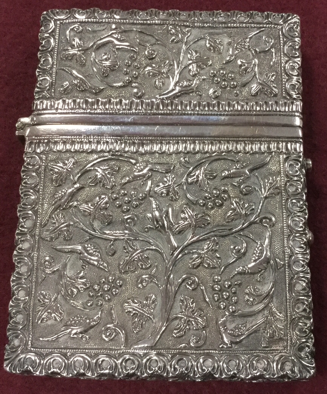 A fine Indian white metal card case chased with birds and vines, 10.5cm Condition Report: Good - Image 3 of 3