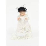 An Oriental bisque head baby doll with fixed eyes, closed mouth and moving limbs,