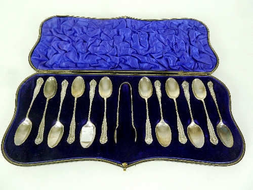 Twelve silver teaspoons, Walker & Hall, Sheffield 1905 and the matching tongs, cased,