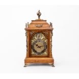 An Edwardian walnut and gilt metal mounted eight-day mantel clock,