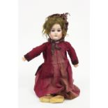 A bisque head doll with weighted eyes, open mouth, jointed limbs, marked VP 12,