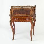 A Louis XV style burr chestnut bureau en pente of bombe form with pierced brass gallery above a