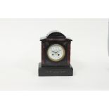 A black marble cased mantel clock,