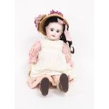 A French bisque head doll with fixed eyes, open mouth, pierced ears and jointed limbs, marked