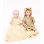 A Lori baby doll with bisque head, weighted eyes, open mouth, moulded hair, moveable limbs,