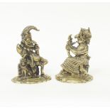 A pair of brass Punch and Judy door stops,