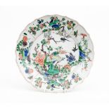 A Chinese famille verte dish, Kangxi, circa 17th Century, decorated in the centre with exotic