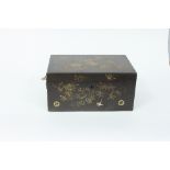 A Chinese lacquer tea box decorated with exotic birds in flowering bushes with a pewter inner box,