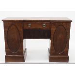 A Regency mahogany pedestal sideboard, the rectangular top on two oval panelled pedestal,