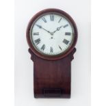 A Regency mahogany wall clock with a circular white enamel convex dial and shaped trunk beneath,