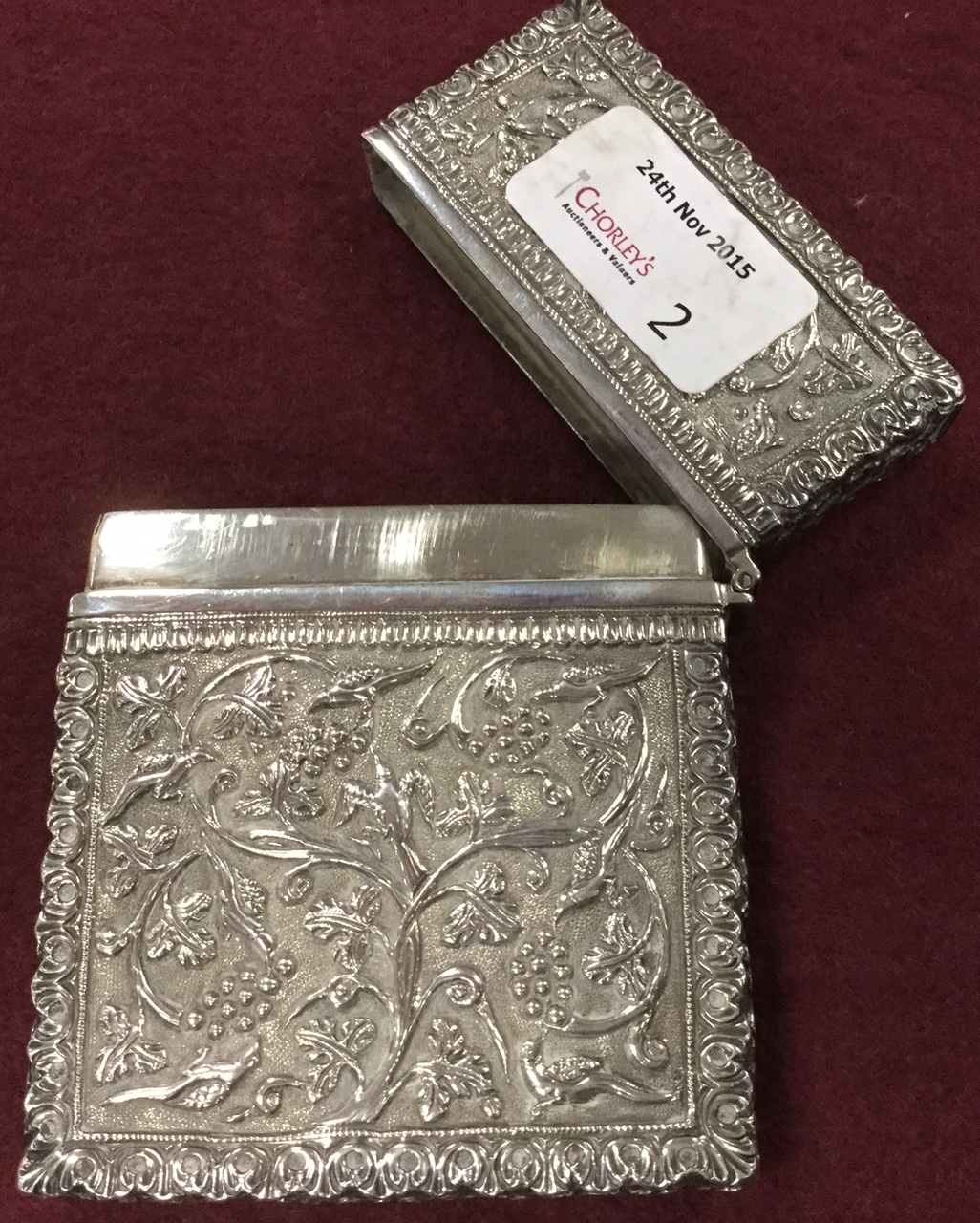 A fine Indian white metal card case chased with birds and vines, 10.5cm Condition Report: Good - Image 2 of 3