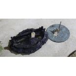 A quatrefoil cast iron boot scraper and a sundial