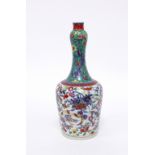 A Chinese bottle vase, Qing Dynasty, blue and white, clobbered in Europe with coloured enamel,