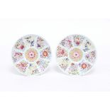 A pair of Chinese famille rose saucer dishes painted with ribbon-tied auspicious objects, 15cm