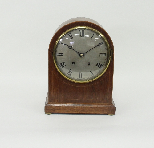 An Edwardian oak arch-top eight day mantel clock, Winterhalder and Hofmeier,