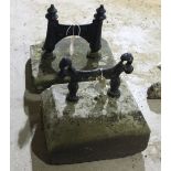 Two boot scrapers on stone bases