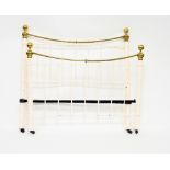 A cast iron and brass bedstead with cream painted rails and brass knobs and top rail,