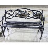 A cast iron garden chair with interwoven back and slatted seat,