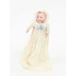 A bisque head baby doll with fixed sleeping eyes, closed mouth and stuffed limbs, initialled AM,