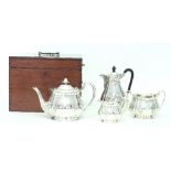 A four piece EPNS tea set of oval form in a mahogany presentation box,