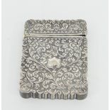 An Indian white metal card case chased with floral scrolls, 10cm wide Condition Report: Overall good