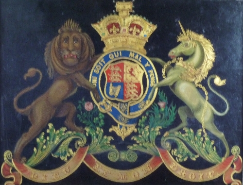 An armorial coach or carriage panel, painted with the Royal coat of arms onto panel, 49cm x 63cm