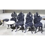 Seven black painted iron chairs and two circular tables