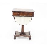 An early 19th Century rosewood work table with frieze drawer and reel moulded wool basket on turned