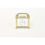 A rectangular gilt brass carriage timepiece, with rectangular dial and eight-day movement,