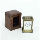 A gilt brass carriage clock in a leather case