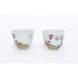 A pair of Chinese famille rose tea bowls, painted with deer amongst peach trees,