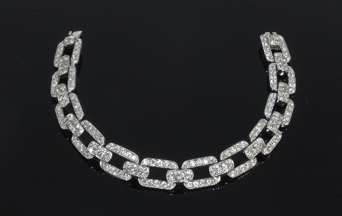 A diamond set bracelet of rectangular links with a tongue clasp, 17.5cm long, approximately 28.