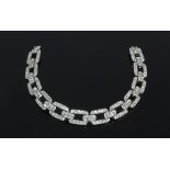 A diamond set bracelet of rectangular links with a tongue clasp, 17.5cm long, approximately 28.